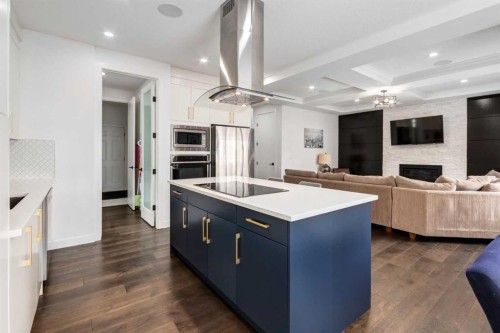 305 Kinniburgh Cove, Chestermere, AB - Indoor Photo Showing Kitchen With Fireplace With Upgraded Kitchen