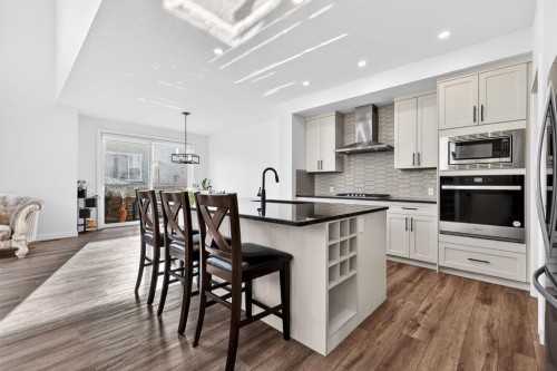 208 Dawson Circle, Chestermere, AB - Indoor Photo Showing Kitchen With Upgraded Kitchen