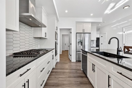 208 Dawson Circle, Chestermere, AB - Indoor Photo Showing Kitchen With Upgraded Kitchen