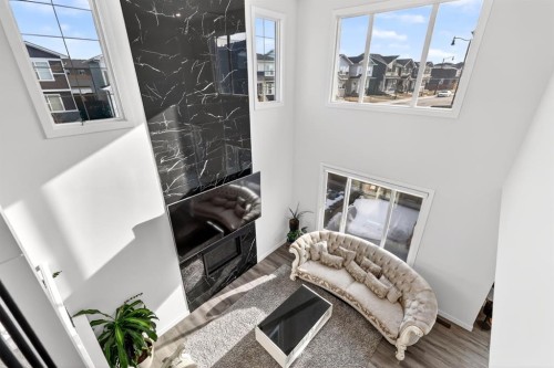 208 Dawson Circle, Chestermere, AB - Indoor Photo Showing Other Room With Fireplace