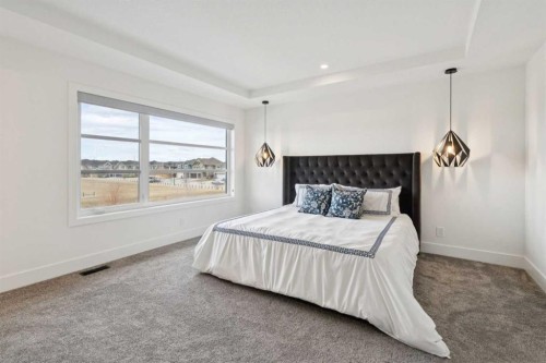 143 Aspen Summit Boulevard Sw, Calgary, AB - Indoor Photo Showing Bedroom
