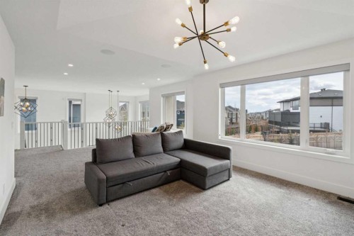 143 Aspen Summit Boulevard Sw, Calgary, AB - Indoor Photo Showing Living Room
