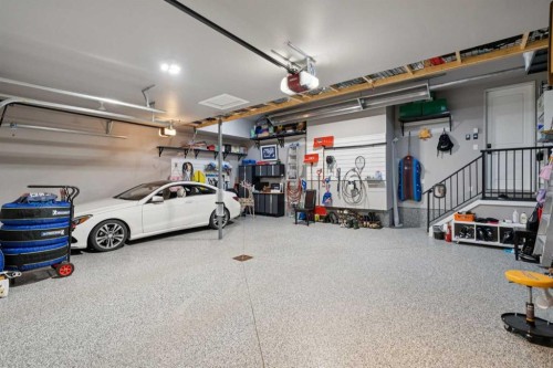 143 Aspen Summit Boulevard Sw, Calgary, AB - Indoor Photo Showing Garage