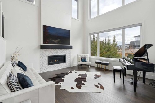 143 Aspen Summit Boulevard Sw, Calgary, AB - Indoor Photo Showing Living Room With Fireplace