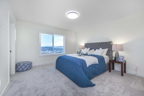 108 Heritage Manor, Cochrane, AB - Indoor Photo Showing Bedroom