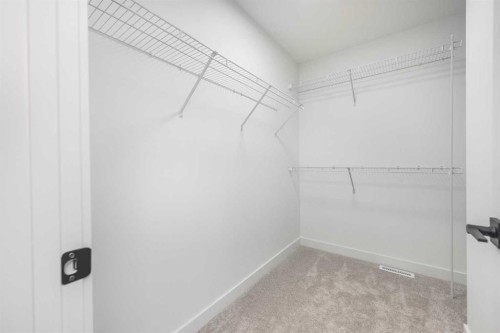 108 Heritage Manor, Cochrane, AB - Indoor With Storage