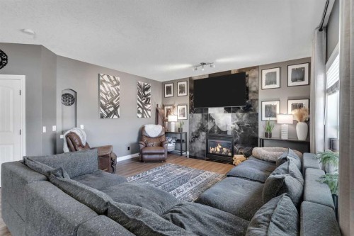 45 Hanson Hollow Ne, Langdon, AB - Indoor Photo Showing Living Room With Fireplace