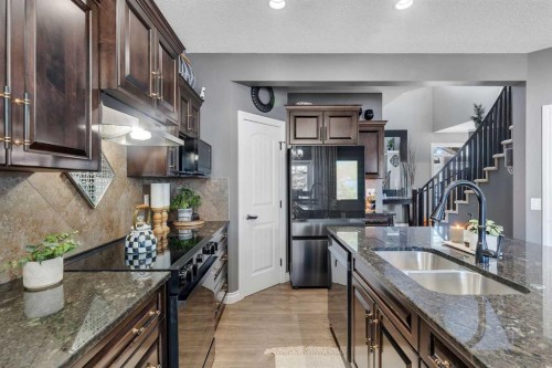 45 Hanson Hollow Ne, Langdon, AB - Indoor Photo Showing Kitchen With Double Sink With Upgraded Kitchen