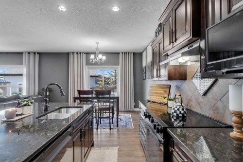 45 Hanson Hollow Ne, Langdon, AB - Indoor Photo Showing Kitchen With Double Sink With Upgraded Kitchen
