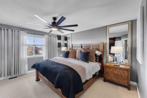 45 Hanson Hollow Ne, Langdon, AB - Indoor Photo Showing Bedroom