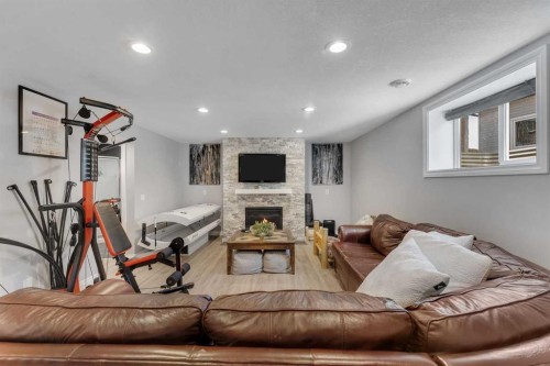 45 Hanson Hollow Ne, Langdon, AB - Indoor With Fireplace