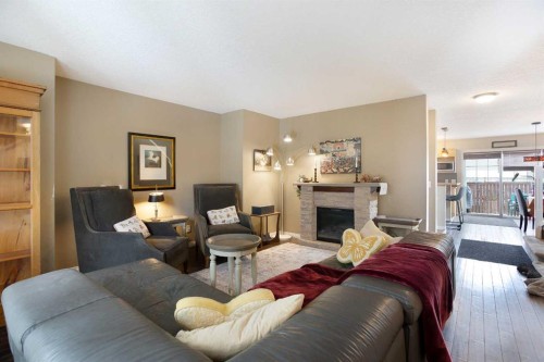 204 Eversyde Circle Sw, Calgary, AB - Indoor Photo Showing Living Room With Fireplace
