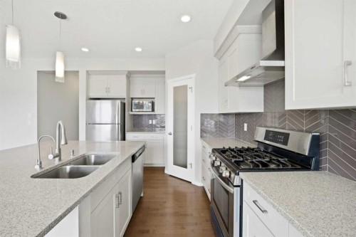 76 Nolancrest Green Nw, Calgary, AB - Indoor Photo Showing Kitchen With Stainless Steel Kitchen With Double Sink With Upgraded Kitchen