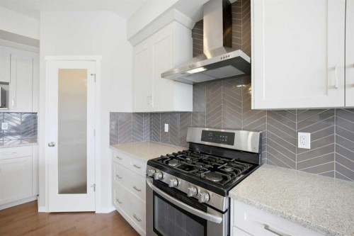 76 Nolancrest Green Nw, Calgary, AB - Indoor Photo Showing Kitchen With Upgraded Kitchen