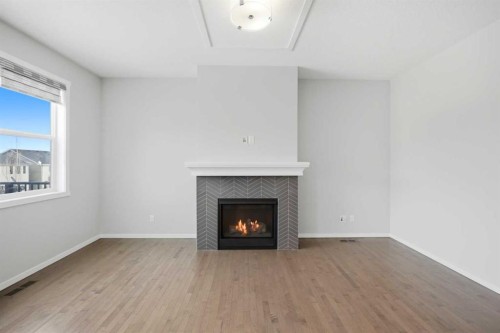 76 Nolancrest Green Nw, Calgary, AB - Indoor Photo Showing Living Room With Fireplace