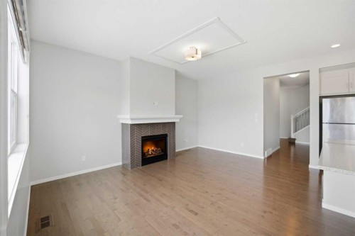 76 Nolancrest Green Nw, Calgary, AB - Indoor With Fireplace