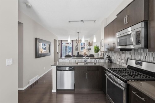 412 Ascot Circle Sw, Calgary, AB - Indoor Photo Showing Kitchen With Stainless Steel Kitchen With Double Sink With Upgraded Kitchen