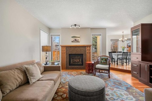 14 Sun Harbour Way Se, Calgary, AB - Indoor Photo Showing Living Room With Fireplace