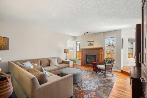 14 Sun Harbour Way Se, Calgary, AB - Indoor Photo Showing Living Room With Fireplace