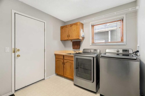 14 Sun Harbour Way Se, Calgary, AB - Indoor Photo Showing Laundry Room