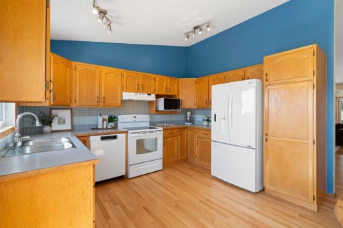 221 Scurfield Place Nw, Calgary, AB - Indoor Photo Showing Kitchen With Double Sink