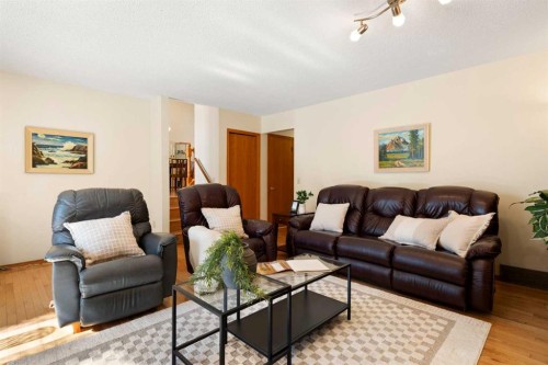 221 Scurfield Place Nw, Calgary, AB - Indoor Photo Showing Living Room