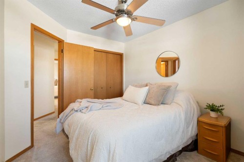 221 Scurfield Place Nw, Calgary, AB - Indoor Photo Showing Bedroom