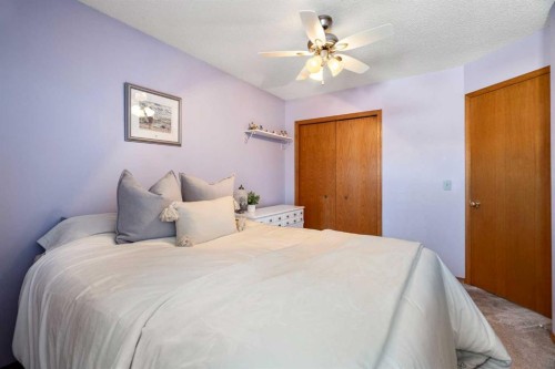 221 Scurfield Place Nw, Calgary, AB - Indoor Photo Showing Bedroom