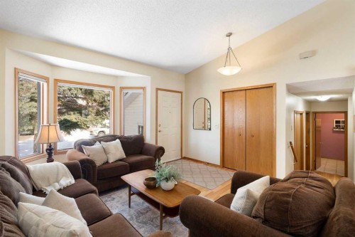 221 Scurfield Place Nw, Calgary, AB - Indoor Photo Showing Living Room