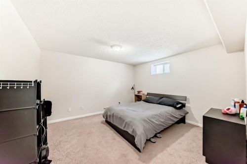 19 Meadowview Road Sw, Calgary, AB - Indoor Photo Showing Bedroom