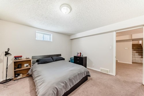 19 Meadowview Road Sw, Calgary, AB - Indoor Photo Showing Bedroom