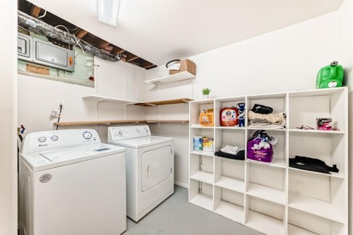 19 Meadowview Road Sw, Calgary, AB - Indoor Photo Showing Laundry Room