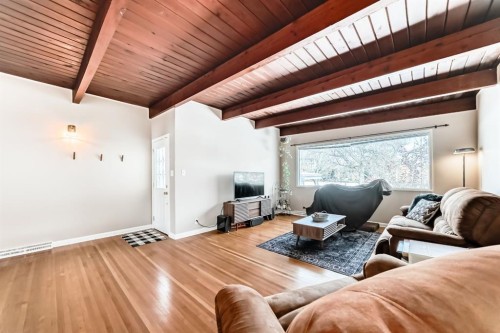 19 Meadowview Road Sw, Calgary, AB - Indoor Photo Showing Living Room