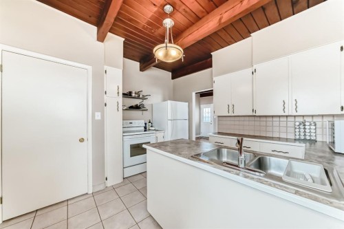 19 Meadowview Road Sw, Calgary, AB - Indoor Photo Showing Kitchen With Double Sink