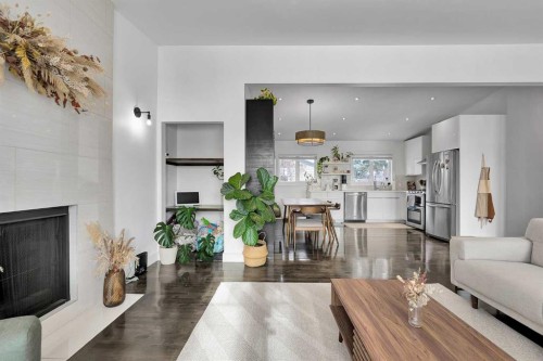 4115 Bowlen Street Nw, Calgary, AB - Indoor Photo Showing Living Room With Fireplace