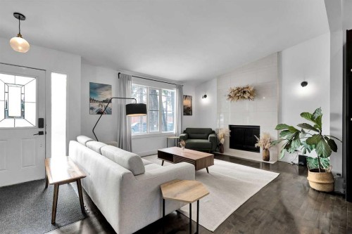 4115 Bowlen Street Nw, Calgary, AB - Indoor Photo Showing Living Room With Fireplace