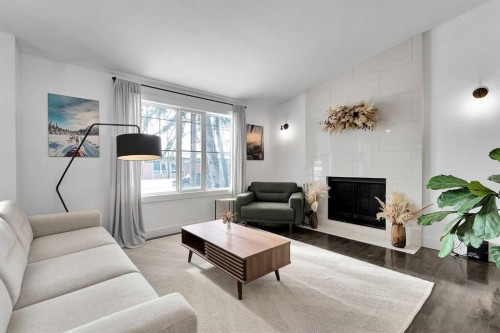 4115 Bowlen Street Nw, Calgary, AB - Indoor Photo Showing Living Room With Fireplace