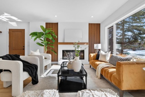 10619 Mapleglen Crescent Se, Calgary, AB - Indoor Photo Showing Living Room With Fireplace