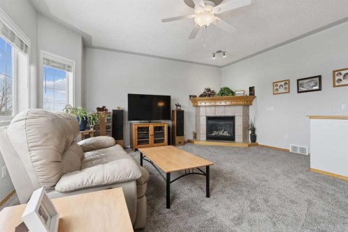 115 Cove Crescent, Chestermere, AB - Indoor Photo Showing Living Room With Fireplace