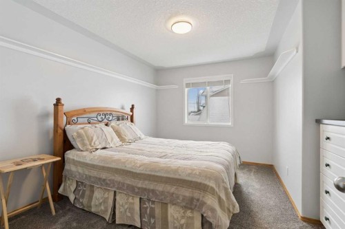 115 Cove Crescent, Chestermere, AB - Indoor Photo Showing Bedroom