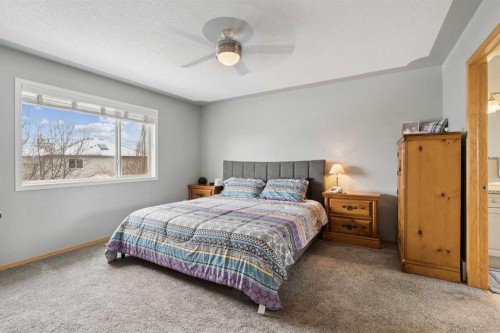 115 Cove Crescent, Chestermere, AB - Indoor Photo Showing Bedroom