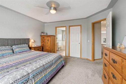 115 Cove Crescent, Chestermere, AB - Indoor Photo Showing Bedroom