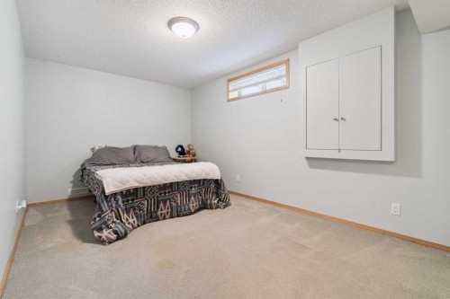115 Cove Crescent, Chestermere, AB - Indoor Photo Showing Bedroom
