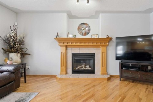 115 Cove Crescent, Chestermere, AB - Indoor Photo Showing Living Room With Fireplace