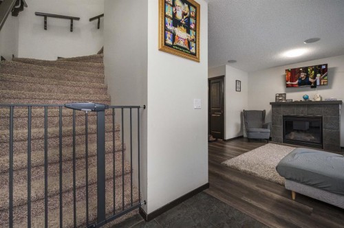 702 Panamount Boulevard Nw, Calgary, AB - Indoor With Fireplace