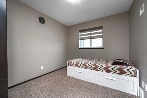 702 Panamount Boulevard Nw, Calgary, AB - Indoor Photo Showing Bedroom