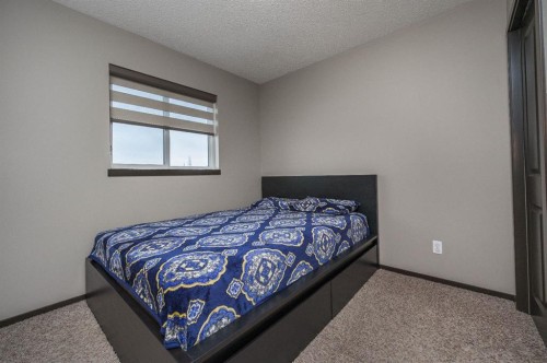 702 Panamount Boulevard Nw, Calgary, AB - Indoor Photo Showing Bedroom
