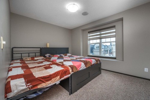 702 Panamount Boulevard Nw, Calgary, AB - Indoor Photo Showing Bedroom