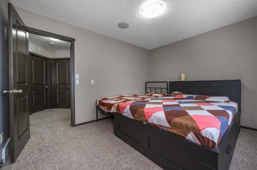702 Panamount Boulevard Nw, Calgary, AB - Indoor Photo Showing Bedroom