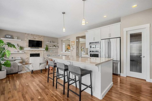 490 Mahogany Manor Se, Calgary, AB - Indoor Photo Showing Kitchen With Fireplace With Upgraded Kitchen